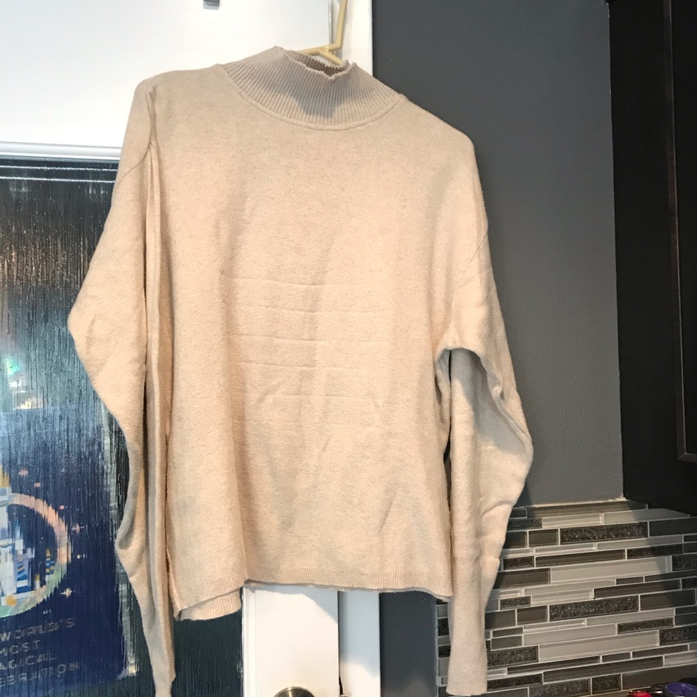 Beige tan Woolrich sweater. Mock turtleneck folds over.